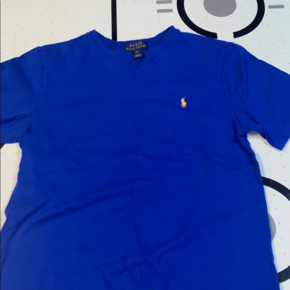 Blue polo tee with yellow horse.